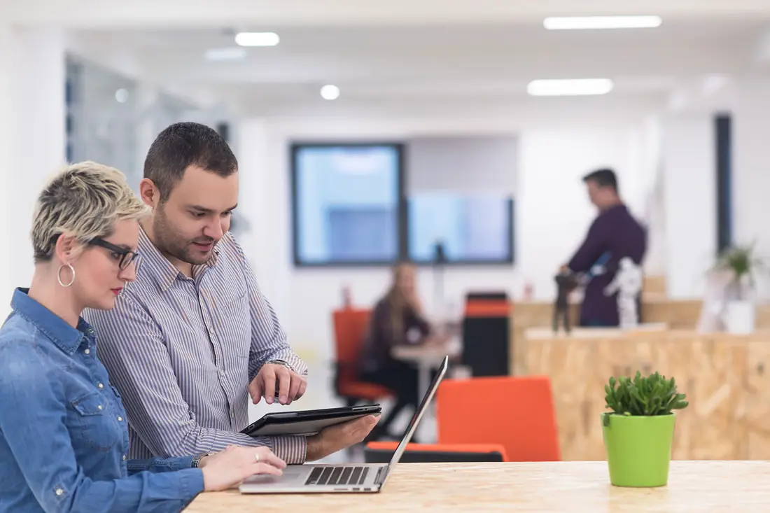 A funding specialist and an owner, on the same side of the table.
